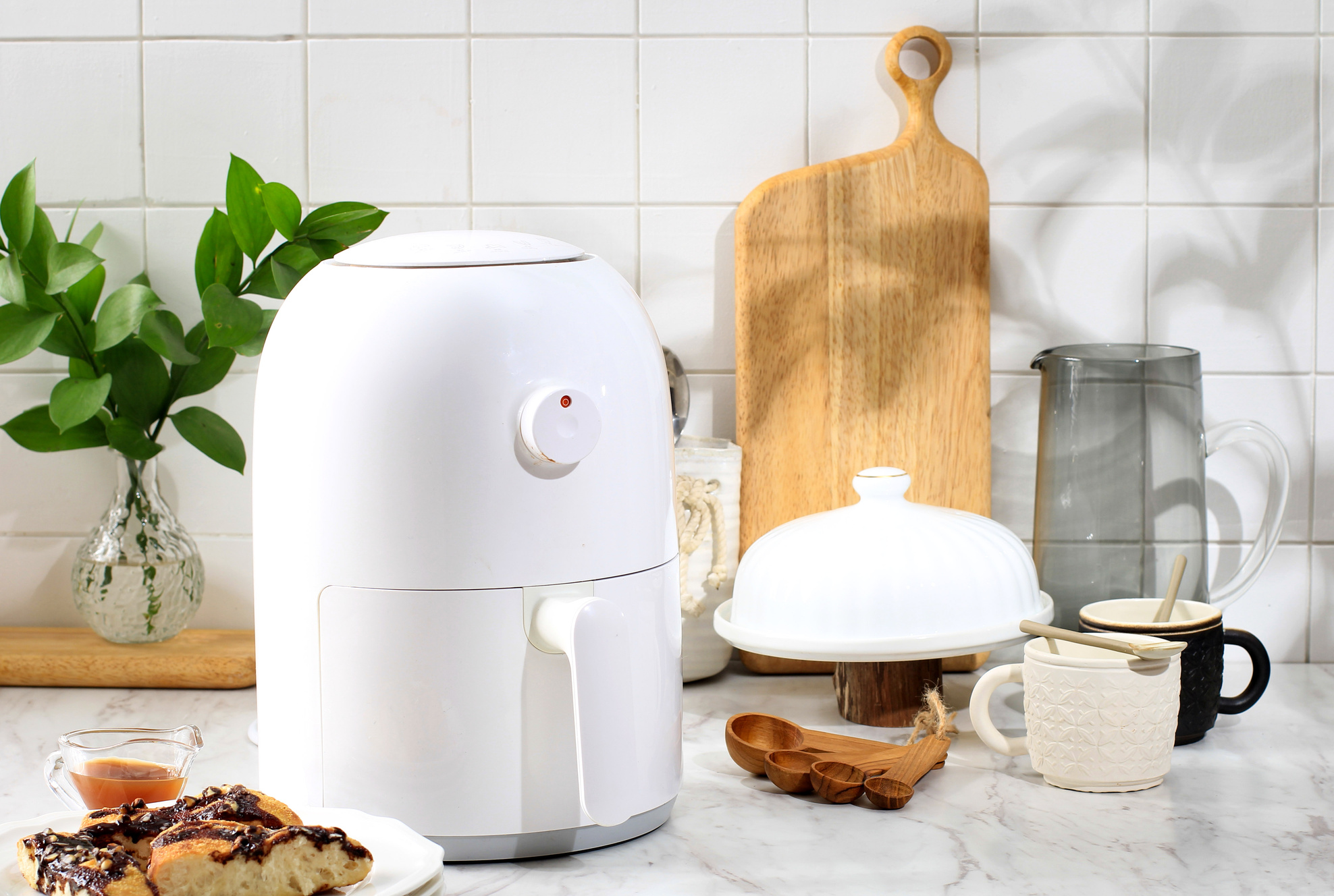 White Mini Air Fryer for Healthy Cooking in the Kitchen. White Kitchen Concept