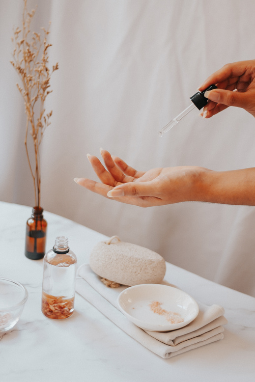 Woman Putting on Serum on Hand