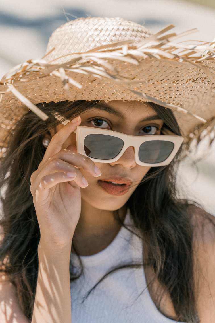 Woman with Shades and Summer Hat